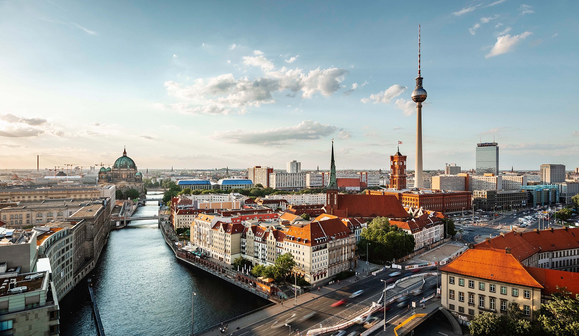 Berlin skyline panorama with TV tower and Spree river at sunset, Germany