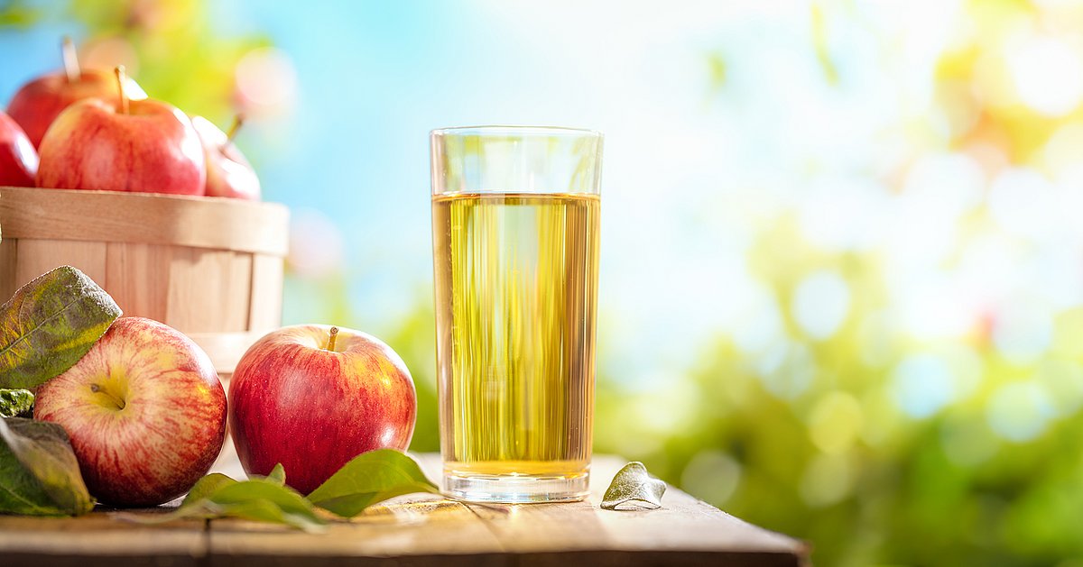 Apple and juice on table