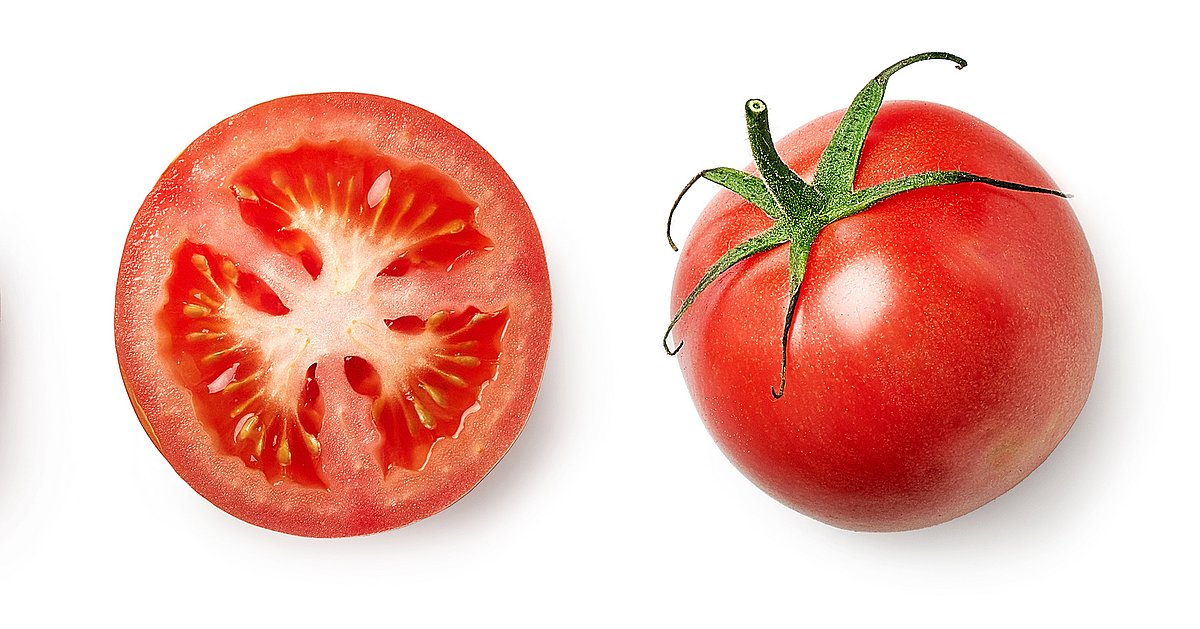 Fresh whole, half and sliced red tomato