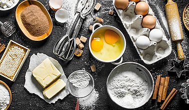 Baking background. Flour and various ingredients for dough.