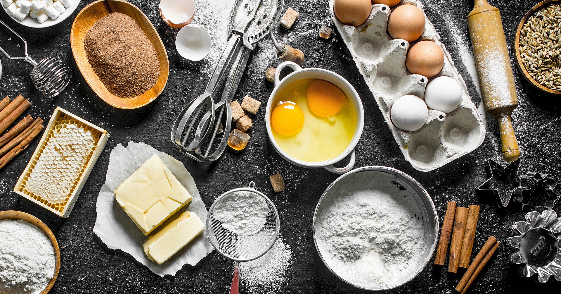 Baking background. Flour and various ingredients for dough.