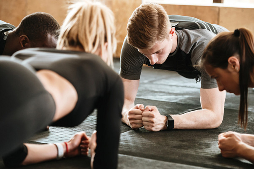 Sports strong people make sport exercises in gym.